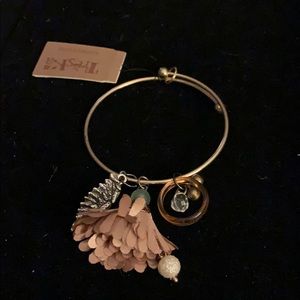 Gold bracelet with charms by Treksa